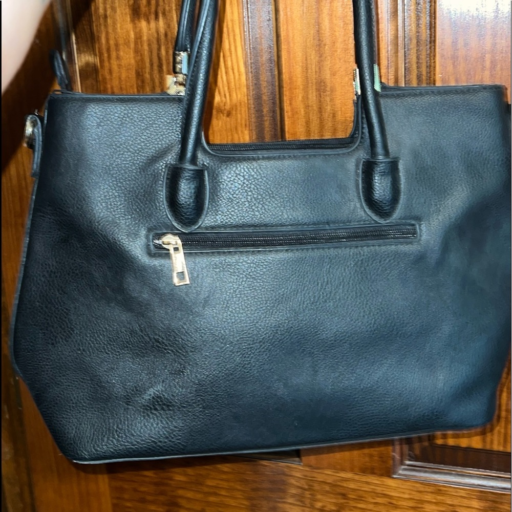 Black Purse with shoulder straps.